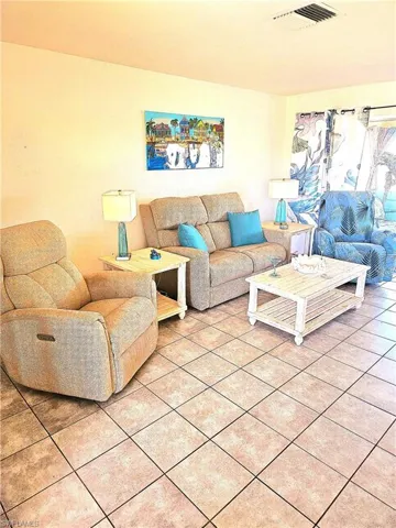 Living room featuring tile flooring