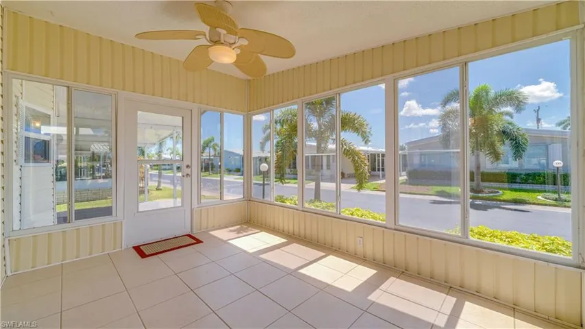 The Series 7000 Aluminum White Sliding Windows, with bronze reflective tint, make this east facing sunroom an added bonus space to loving enjoy.