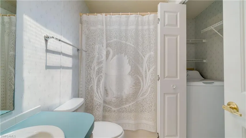 The second bath, with a shower and tub combo, also houses a new washer and dryer (12/2022). How convenient.