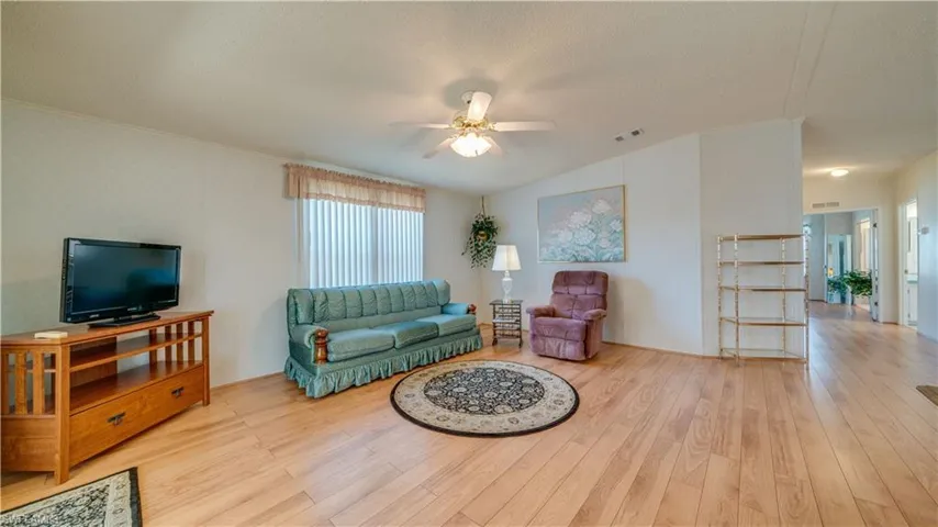 The living room provides great space. It is also bright and cheerful.