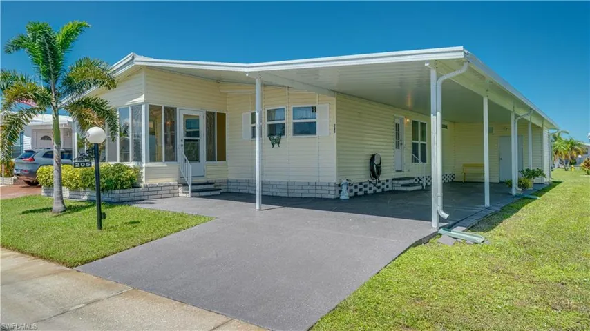 Thge decorative, extended driveway, is just lovely. If you'd like to add an outside patio, yes, there is room!