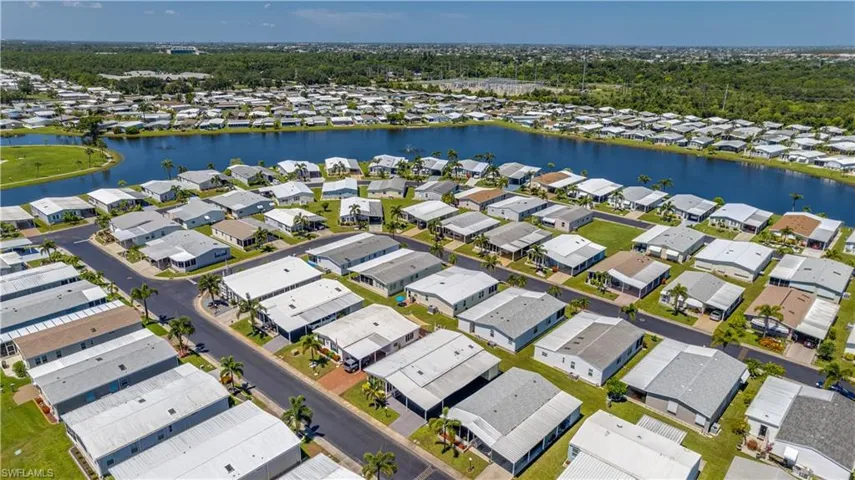 This bird's eye view shows a very well-maintained community, featuring sidewalks and street lights.