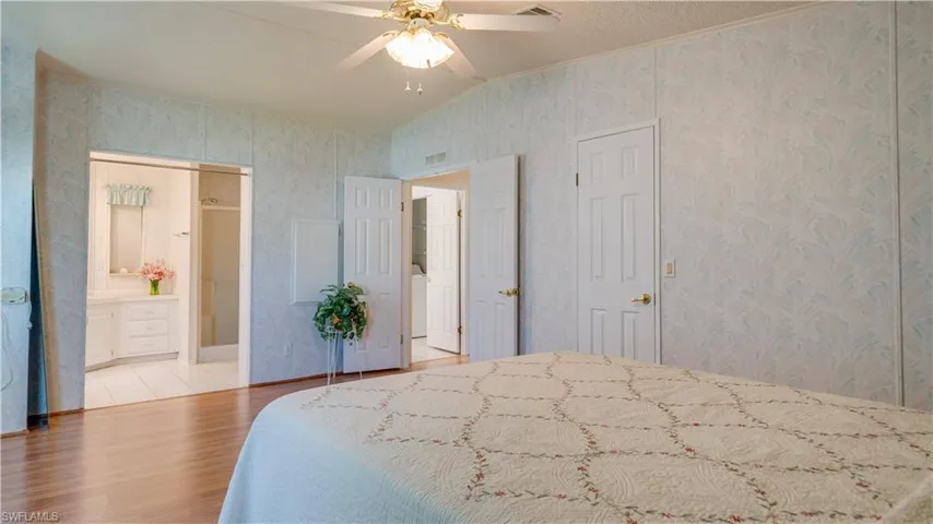 The master bath readily provides easy access, featuring an oversize entry door and a walk-in shower.