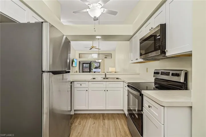 View from Breakfast room, all new,stainless appliances, new flooring and lighting.