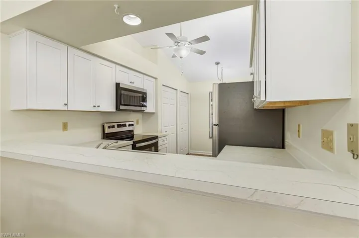 Pass through from kitchen to dine-in Greatroom.