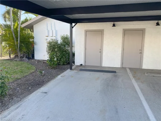 Storage is the door on the left, which is ahead of the units covered parking spot # 55
