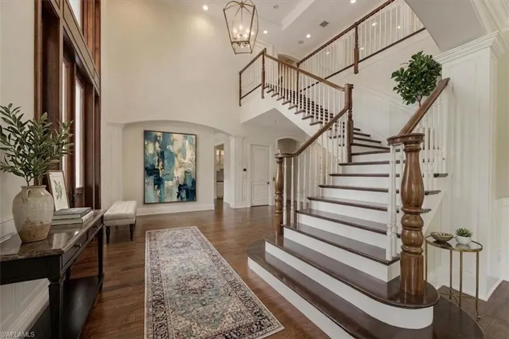 Virtually staged. Grand foyer with 18' ceilings