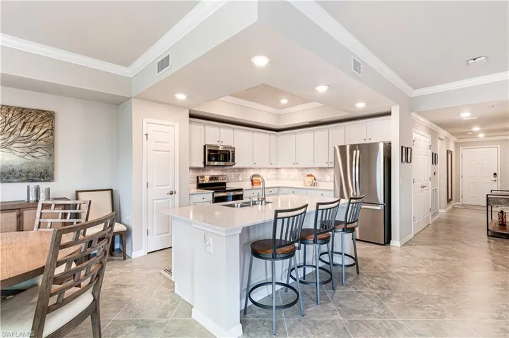 Quartz Countertops, Stainless Steel Appliances, Under Cabinet Lighting, Tile Backsplash