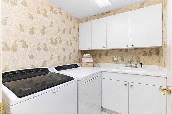 Laundry room with sink, and plenty of storage cabinets