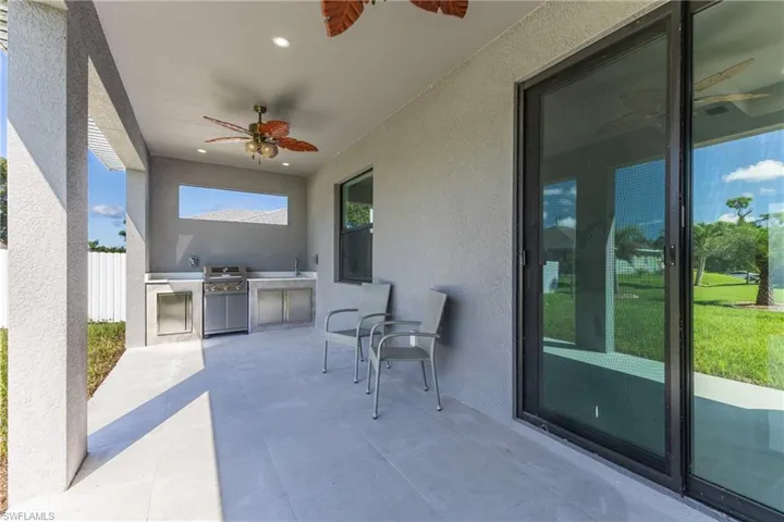 View of patio / terrace featuring exterior kitchen and ceiling fan