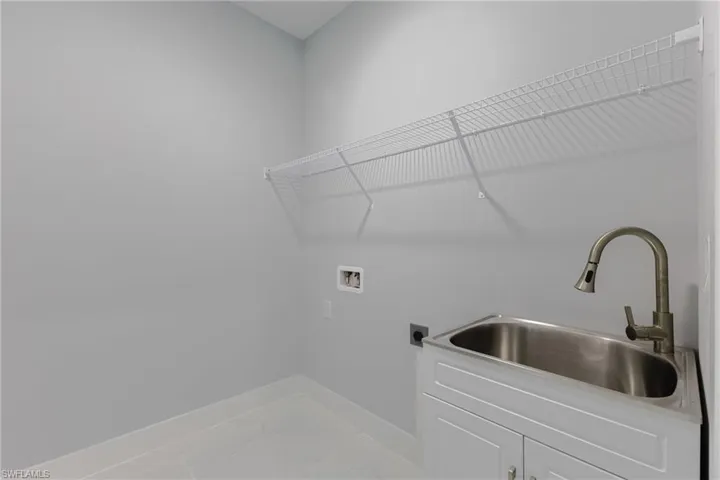 Laundry room featuring hookup for a washing machine and electric dryer hookup