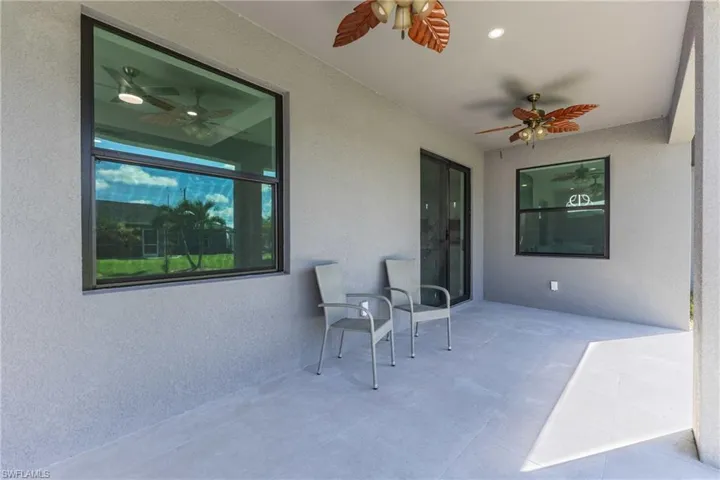 View of patio featuring a ceiling fan