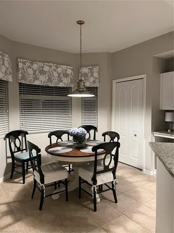 Dining space featuring light tile floors