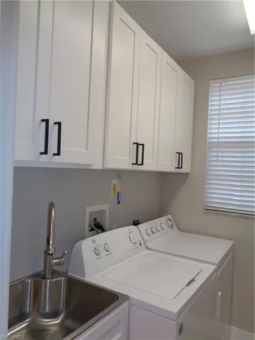 Laundry room with washer and dryer and cabinet space
