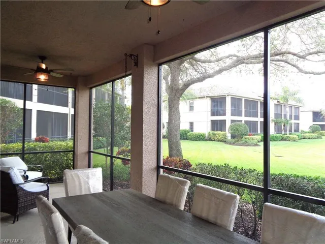 Sunroom with a ceiling fan, outdoor dining space, and healthy amount of natural light
