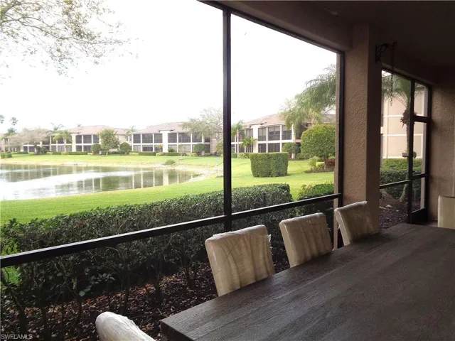 Sunroom with a water view