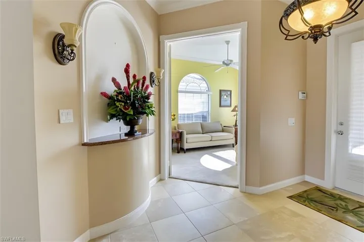 Entryway featuring ornamental molding, access to the Den/Office and Great Room