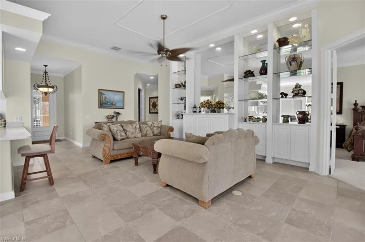 Living area with built in wall/shelves unit