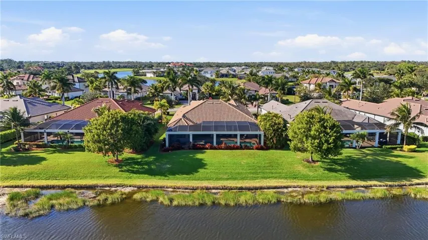 Aerial perspective of suburban area with a large body of water