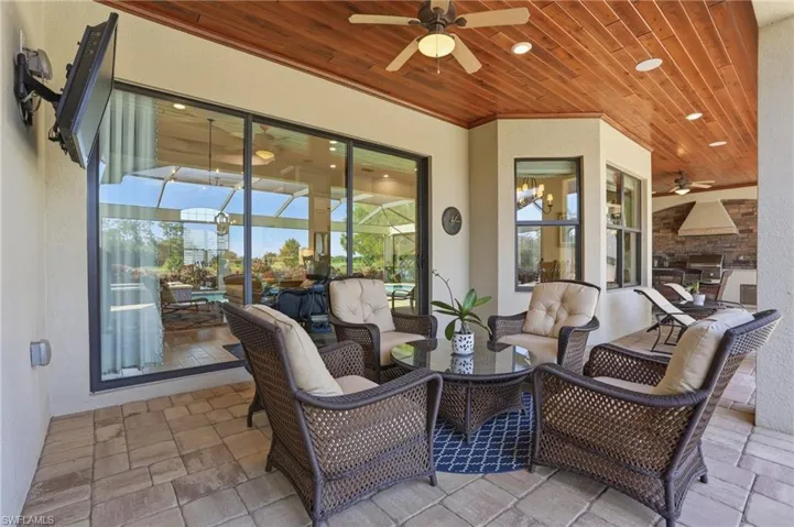 View of patio / terrace featuring a ceiling fan, outdoor dining space, an outdoor living space, and grilling area