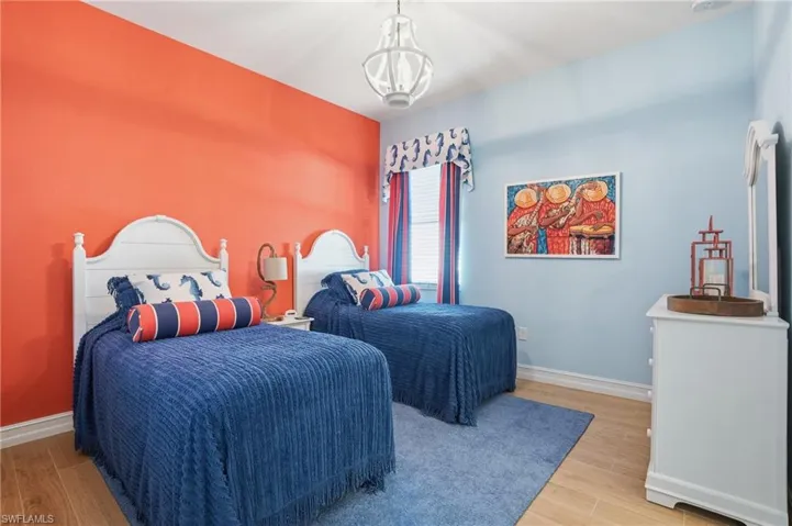 Bedroom with wood finish floors