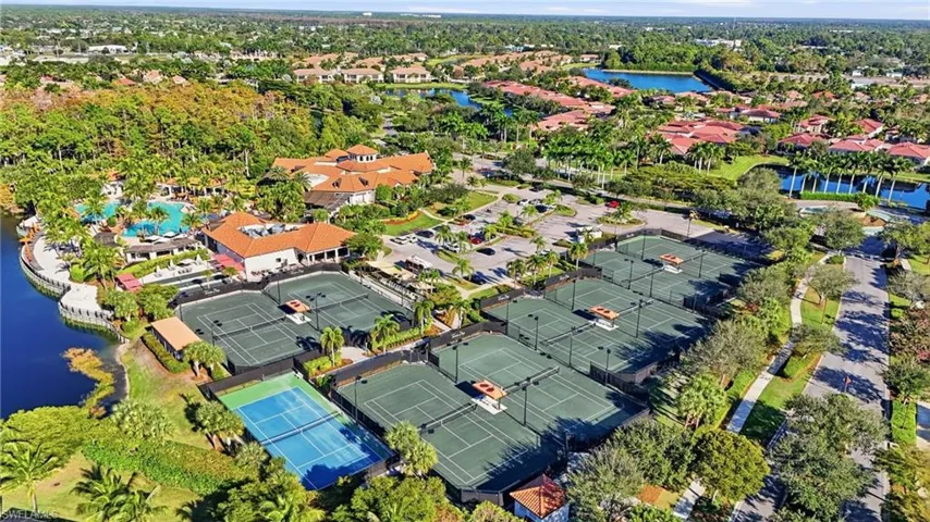 Aerial overview of property's location featuring a large body of water and nearby suburban area
