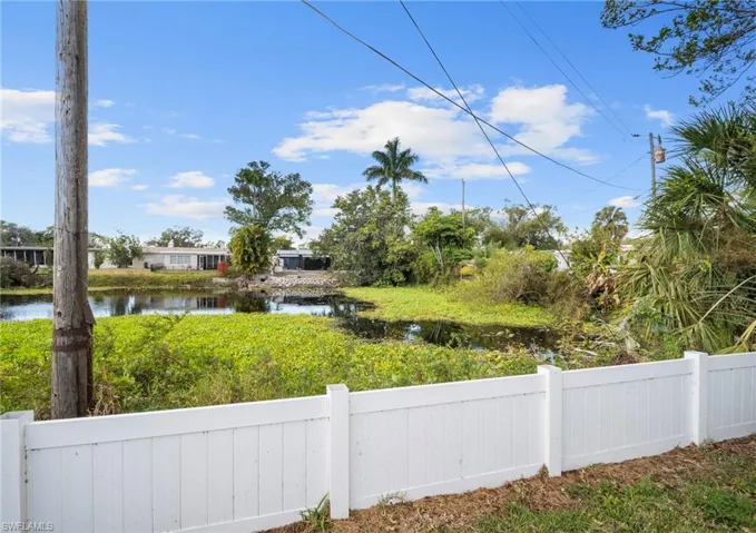 View of yard with a water view