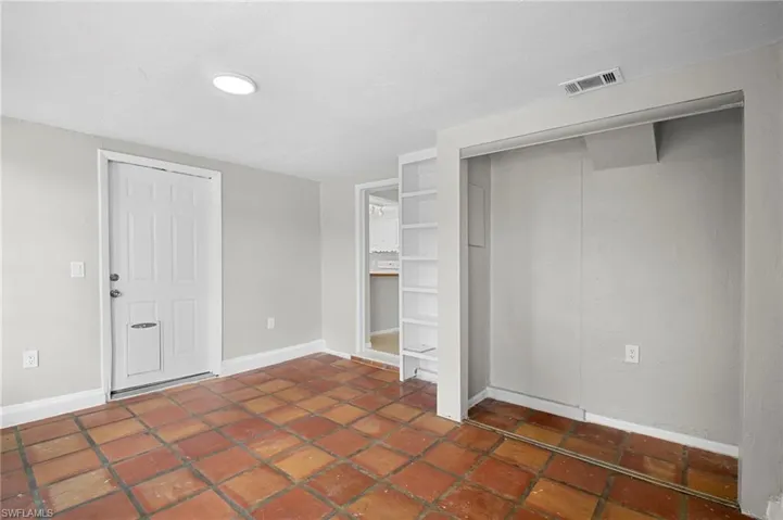 Unfurnished bedroom with baseboards and a closet