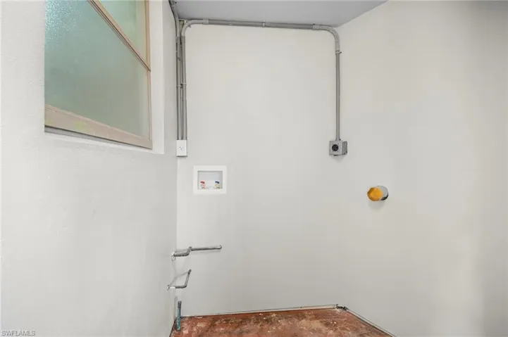 Laundry area featuring hookup for a washing machine and concrete floors
