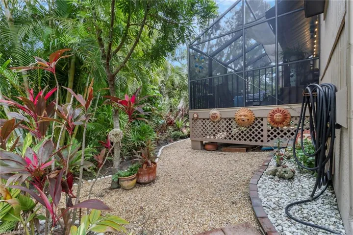 View of yard featuring glass enclosure