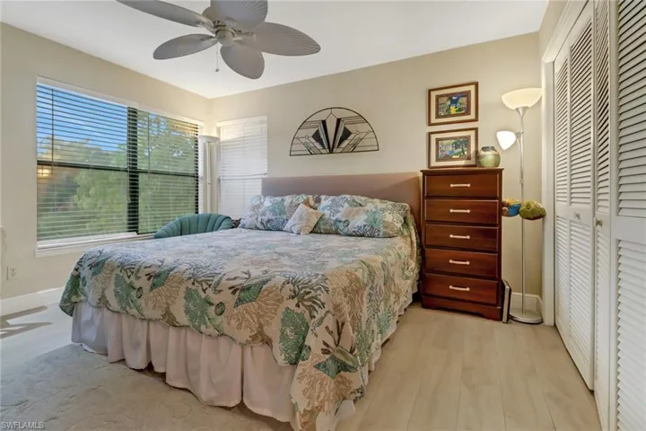 Guest Bedroom featuring ceiling fan, a closet, and light hardwood / wood-style flooring