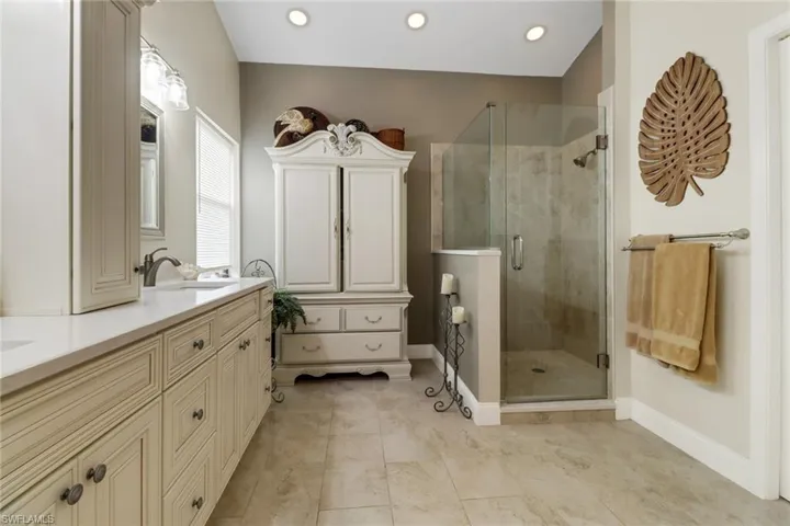 Master Bathroom with vanity and an enclosed shower
