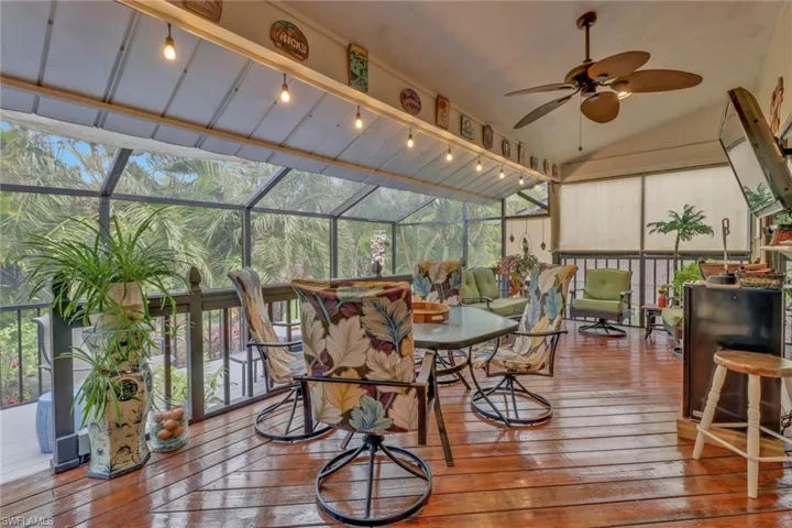 Sunroom with ceiling fan and lofted ceiling