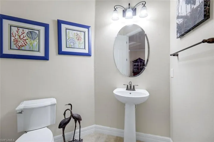 Bathroom featuring baseboards and tile patterned flooring