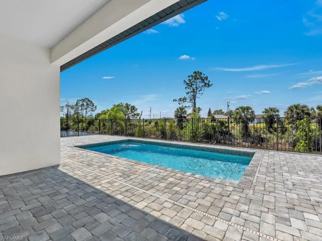 View of pool featuring a fenced in pool, a patio, and fence