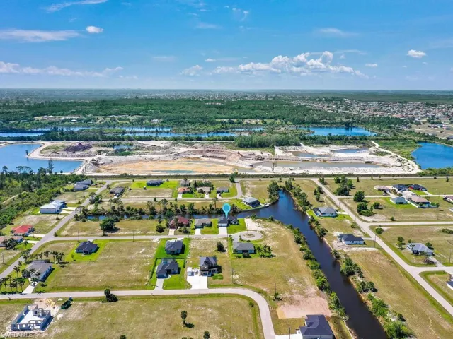 Bird's eye view featuring a water view and a residential view