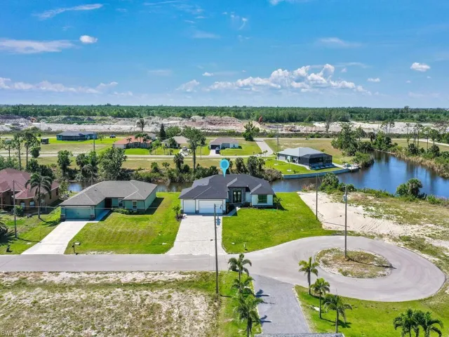 Drone / aerial view featuring a residential view and a water view