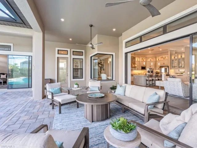 View of patio featuring an outdoor living space with a fire pit and ceiling fan