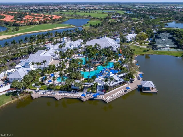 Aerial perspective of suburban area with a nearby body of water