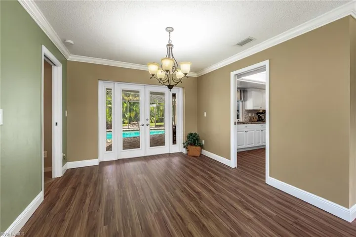 Formal Dining Room with French doors out to the pool area!
