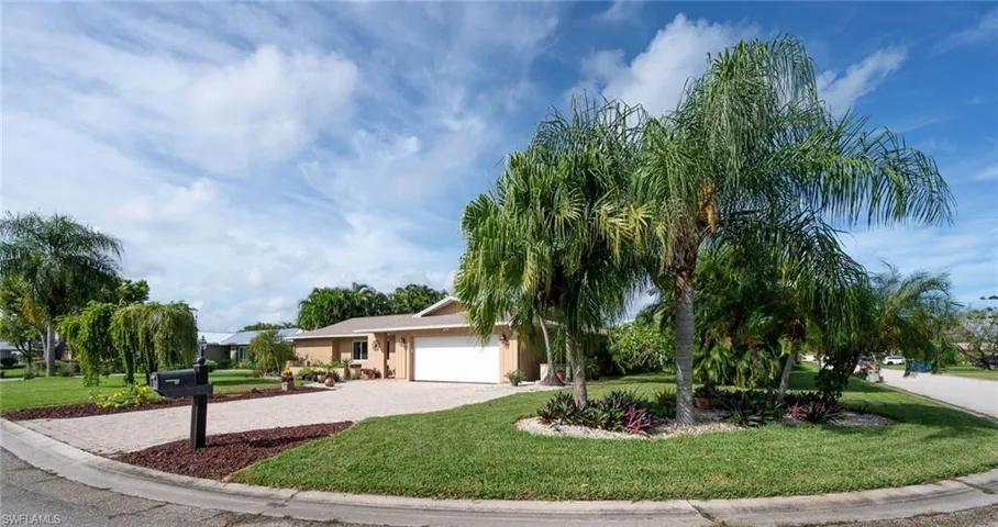 Corner lot with lush landscaping.