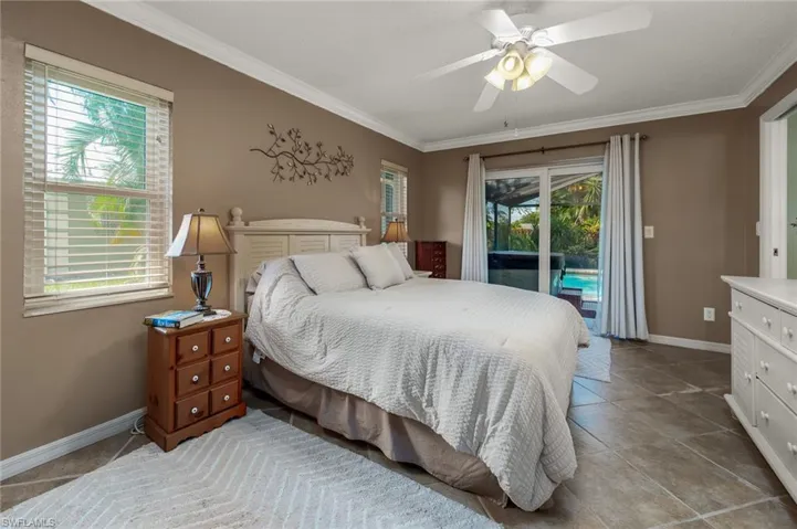 Primary bedroom with slider to the pool & hot tub.