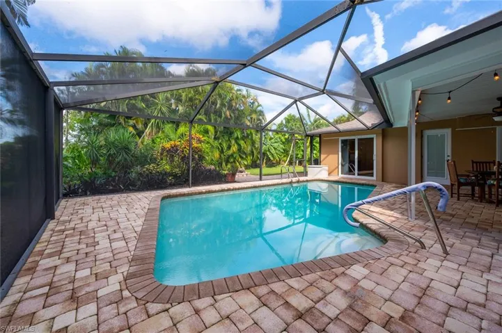 Screened in pool with access to the back yard.