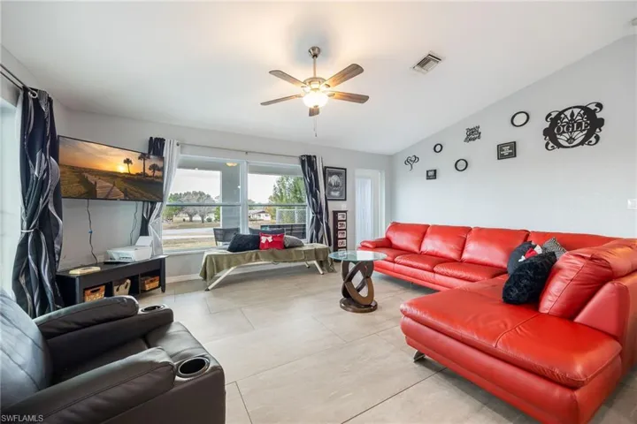 Living area featuring ceiling fan