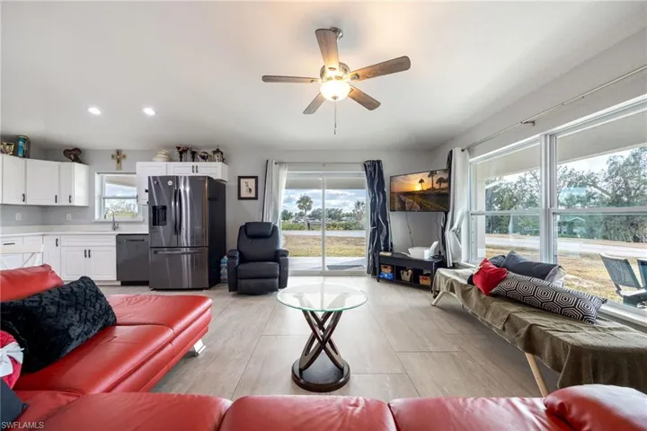 Living area with ceiling fan and recessed lighting
