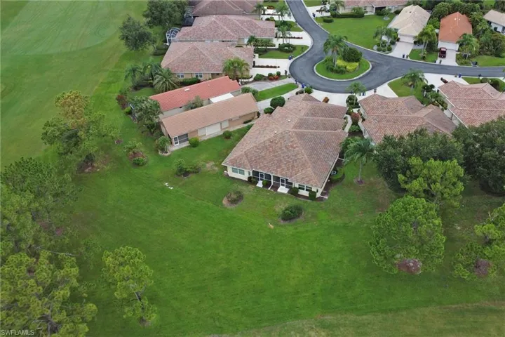 Aerial overview of property's location with nearby suburban area