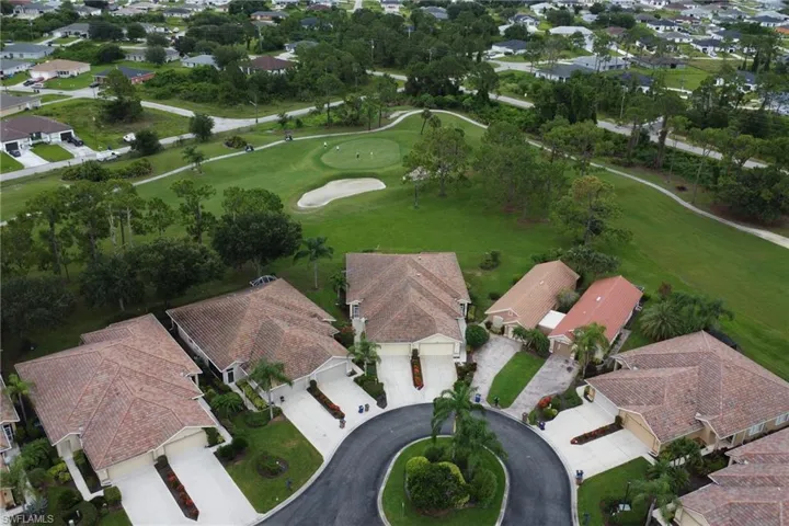 View of property location with nearby suburban area and a golf course