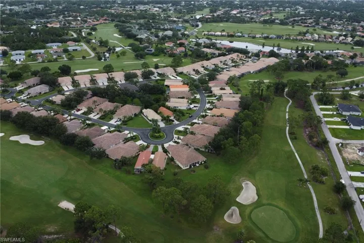 View of property location with nearby suburban area and a golf course