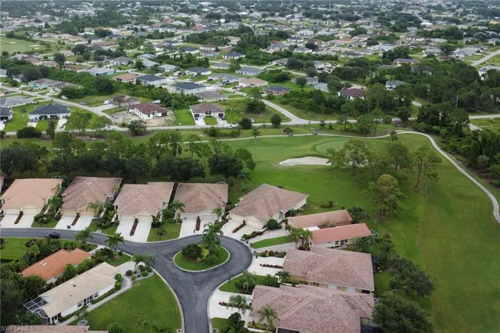 Aerial overview of property's location with nearby suburban area