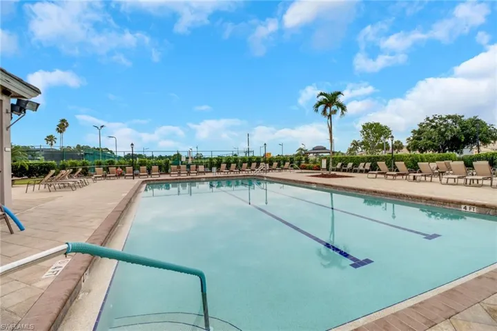 Community pool with a patio area